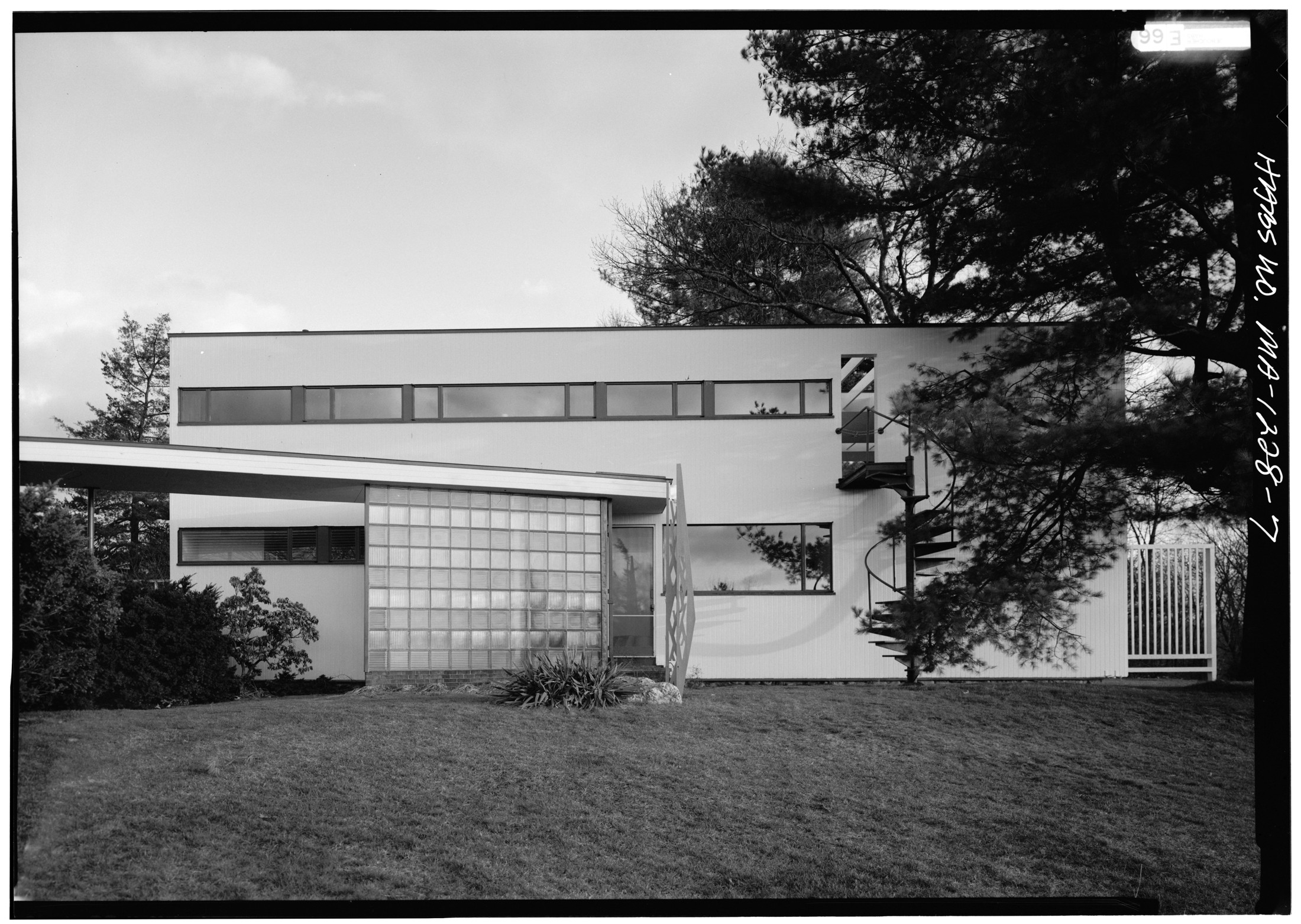 The Gropius House, with ribbon windows, glass block, and surrounding trees.